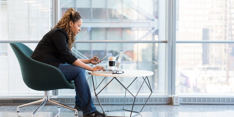 Woman in an office working at her laptop