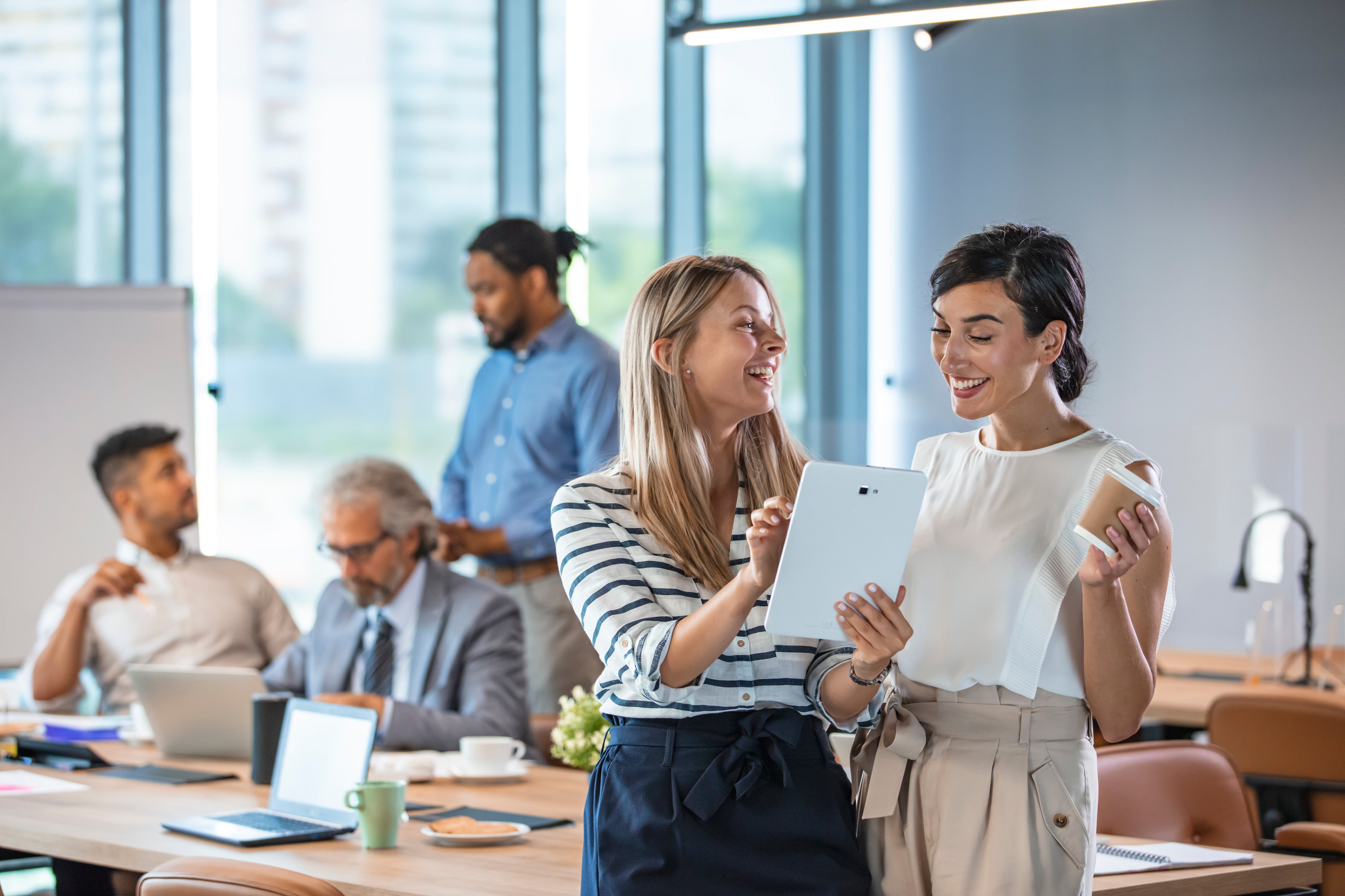 An image of colleagues in Germany working on a project together in an office