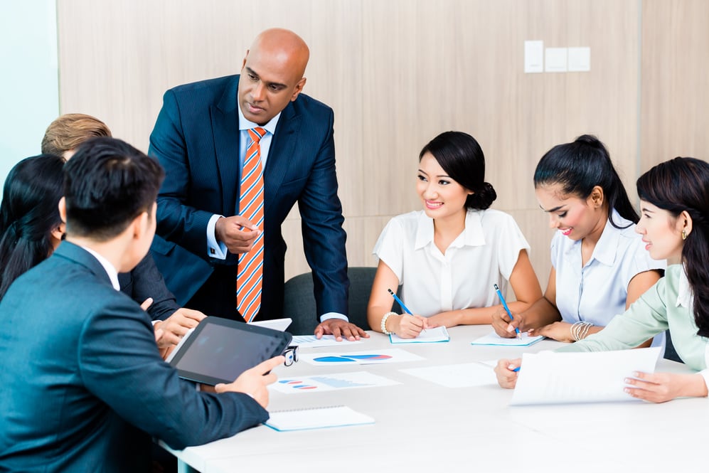 A meeting taking place in an office in Indonesia