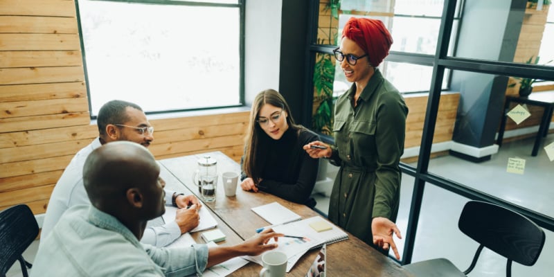 Team of multicultural businesspeople having a discussion during a boardroom meeting
