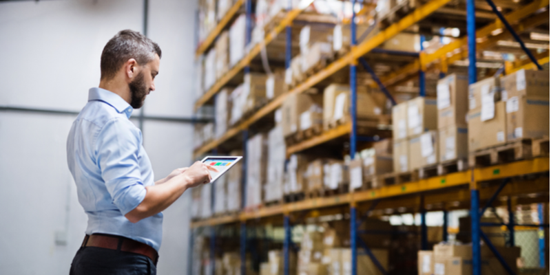 man standing in a storage facility