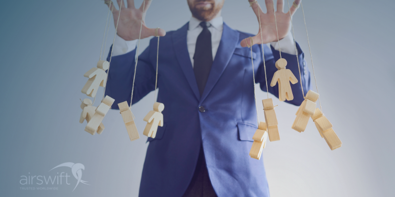 Puppet master dressed as a boss